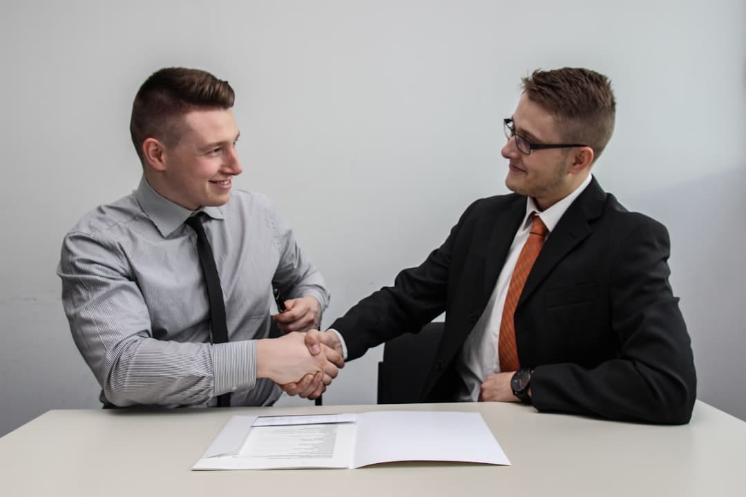 Two business professionals shaking hands