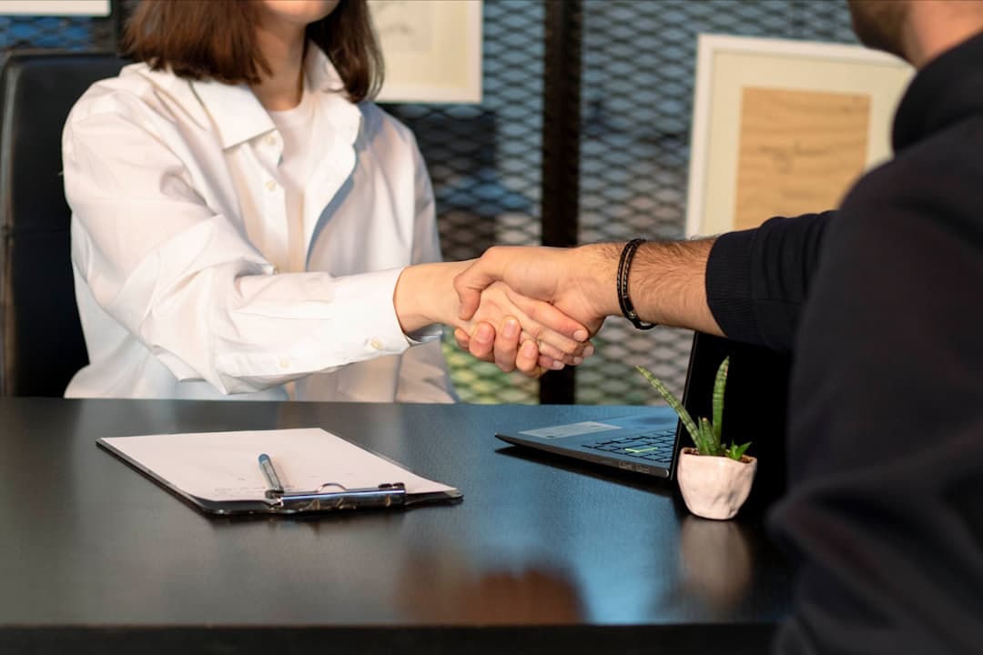 The heybayu agency team shaking hands with a client